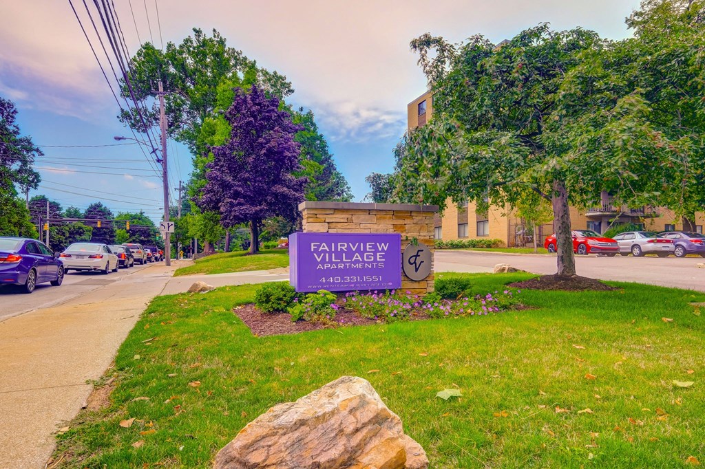 the sign for fairview village at the corner of a street