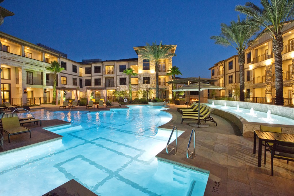 a swimming pool at night at the resort at night