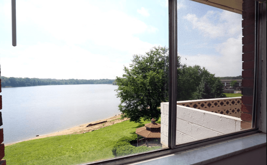 A view of a lake from a window.