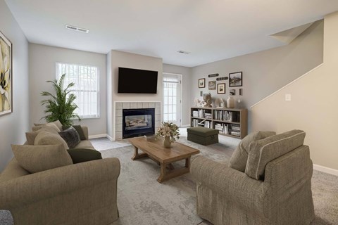A living room with a fireplace and a television.