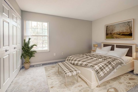 A bedroom with a bed, a bench, and a painting on the wall.