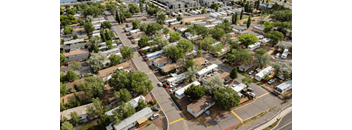 A bird's eye view of a residential area with houses and trees.