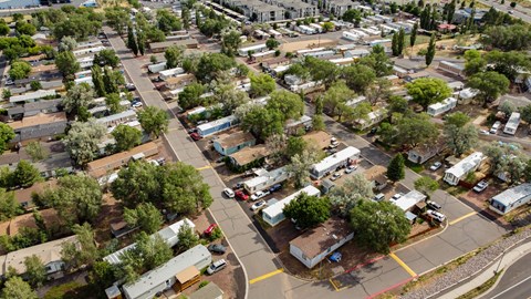 an aerial view of a city with trailers and trees