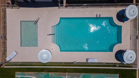 A large rectangular pool with a smaller square pool next to it.