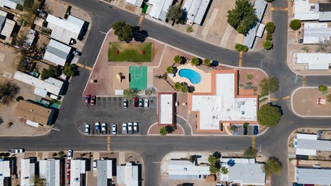 A view of a street with cars and buildings.