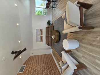 A bathroom with a wooden wall and a brown patterned floor.