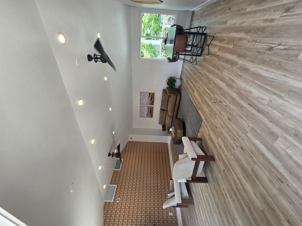 A room with a wooden wall and a carpeted floor.