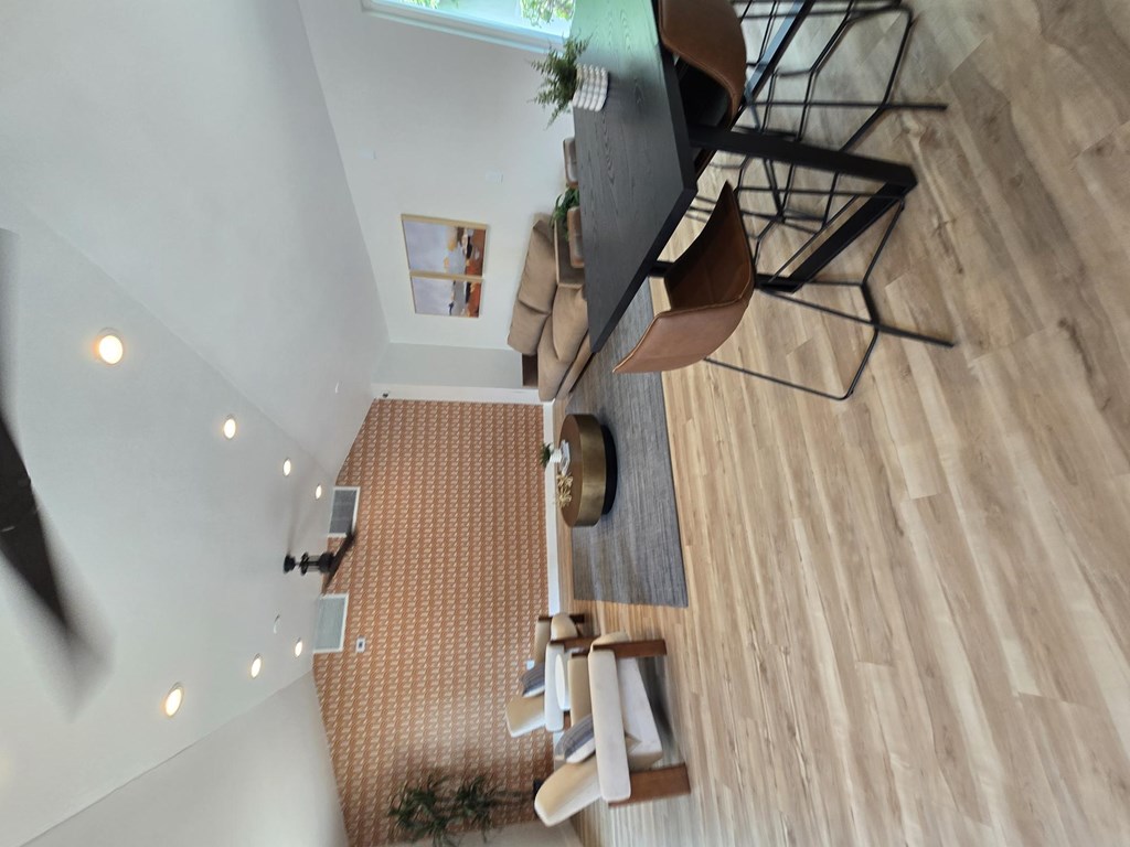 A living room with a couch and a television.