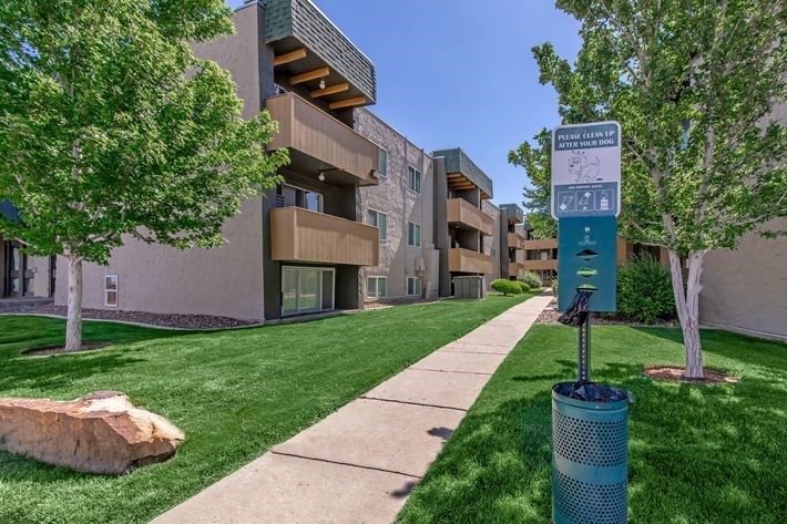 A sign in front of a building reads "Apartments.".