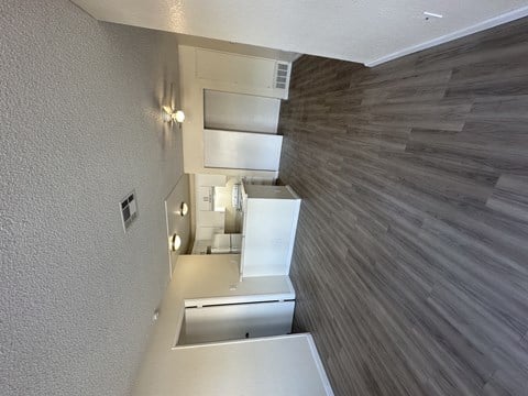 a view of the kitchen and living room from the top of the stairs