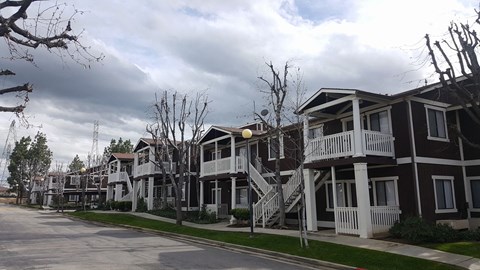 a row of houses on the side of a street