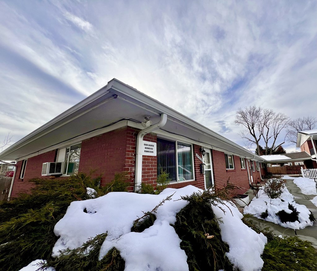 a house with snow in front of it