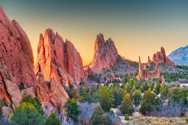 a view of the garden of the gods at sunset