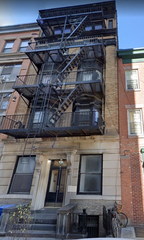 A fire escape on a brick building.
