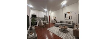 A modern living room with a grey couch and a coffee table.