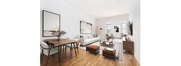 A modern living room with a wooden table and chairs.