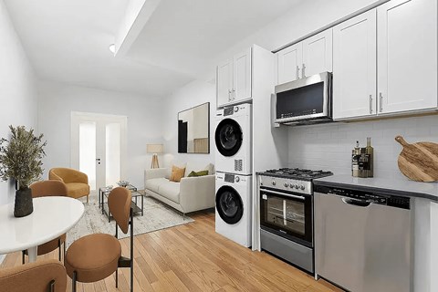 A modern kitchen with a dining table and chairs.