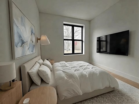 A bedroom with a large bed and a painting on the wall.