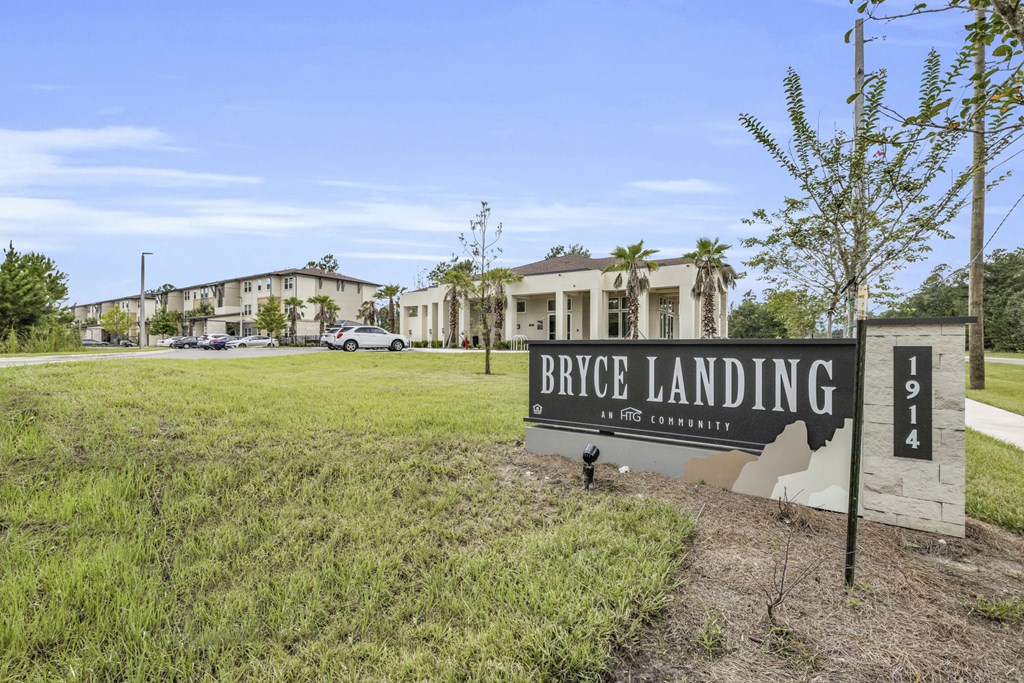 a sign that reads bicycle landing in front of some buildings