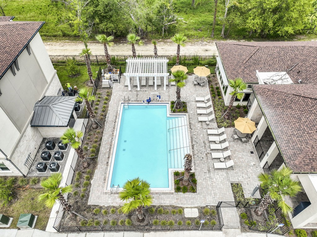 a pool is shown in the backyard of a house