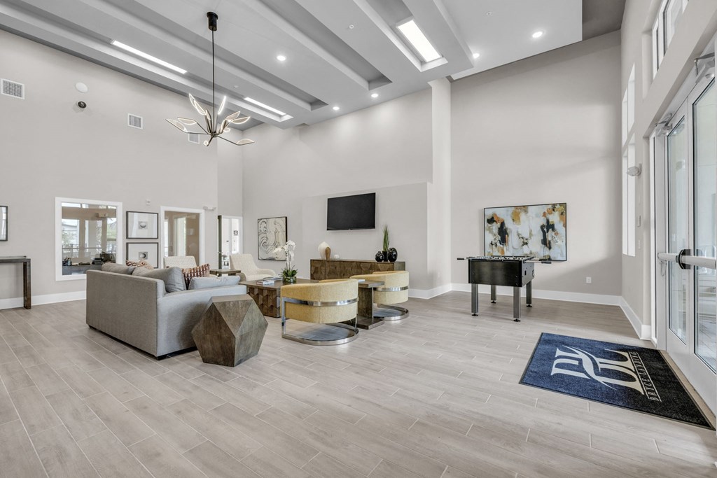a living room with a couch and a piano