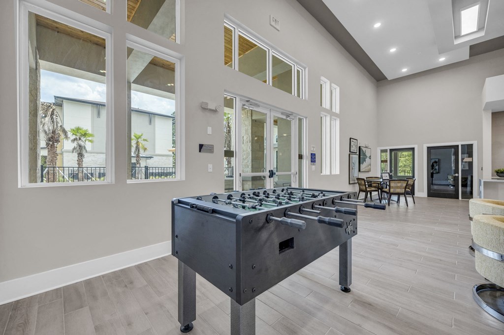 a foosball table in the center of a living room