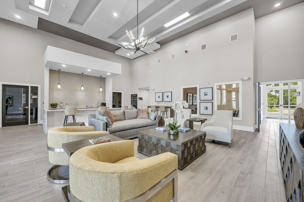 a living room with couches and chairs and a table
