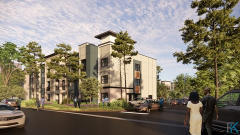 A modern building with a green roof is surrounded by trees and cars are driving by.