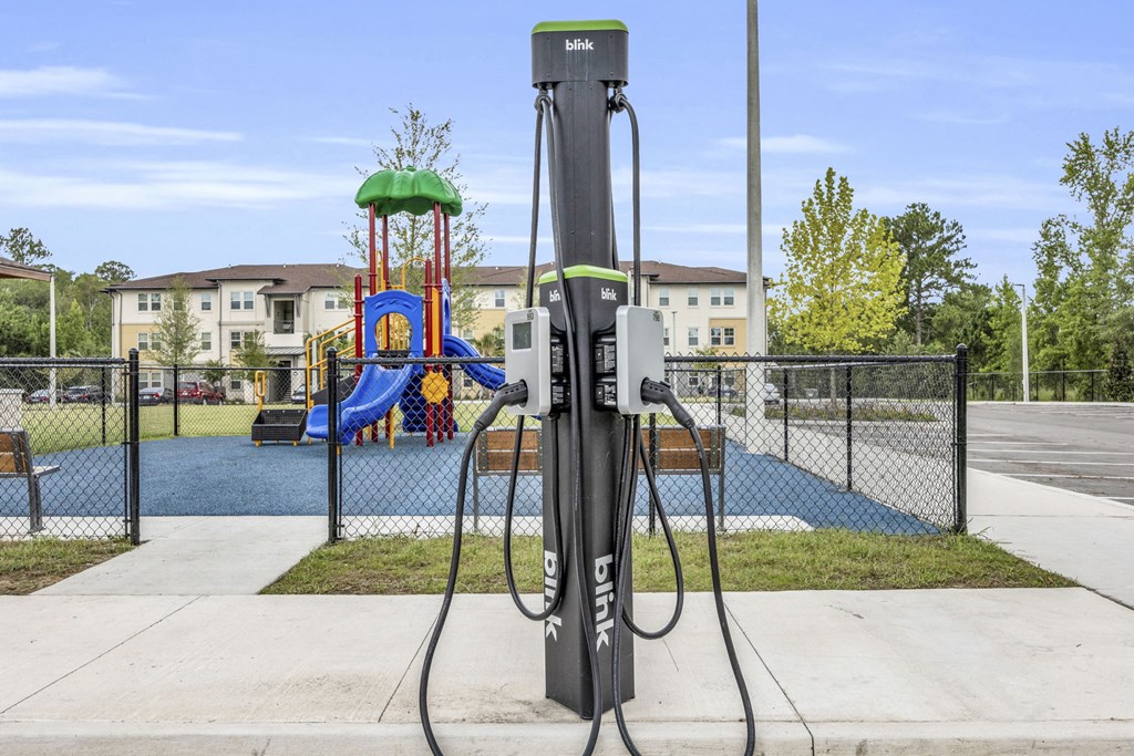 a charging station in front of a playground