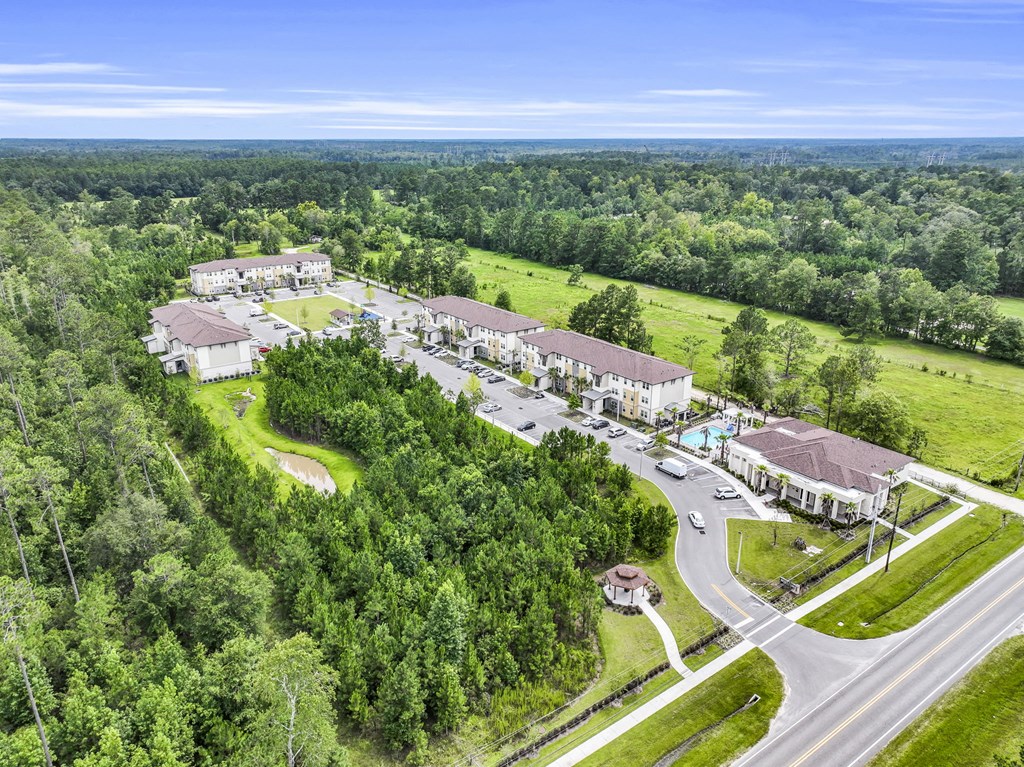 a aerial view of a group of buildings and a road