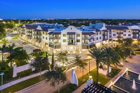 an aerial view of a large apartment complex at night
