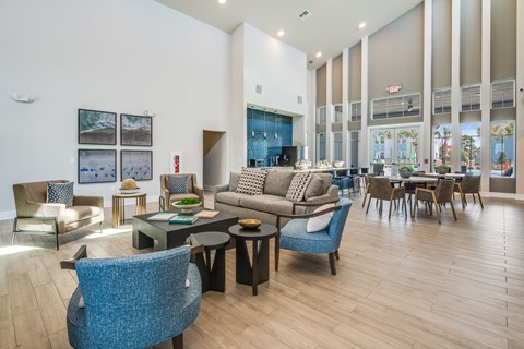 A living room with a blue chair in the foreground.