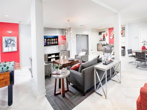 A living room with a grey couch and a coffee table.