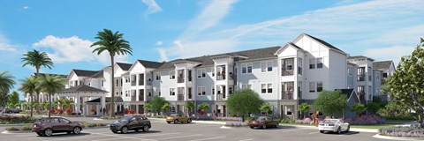 A large white building with a parking lot in front of it.