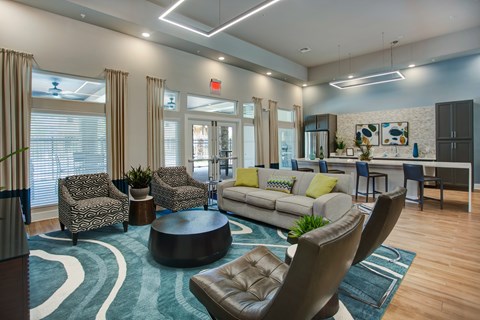 A modern living room with a round coffee table and a sofa.