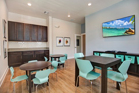 A modern dining room with a wooden table and chairs.