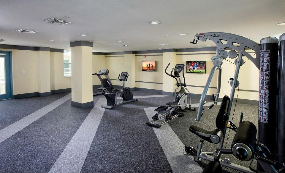 a room filled with lots of exercise equipment