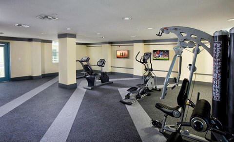a room filled with lots of exercise equipment