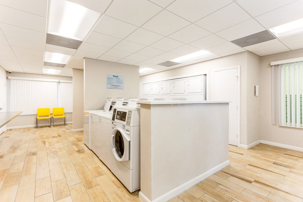 a laundry room with a washer and dryer
