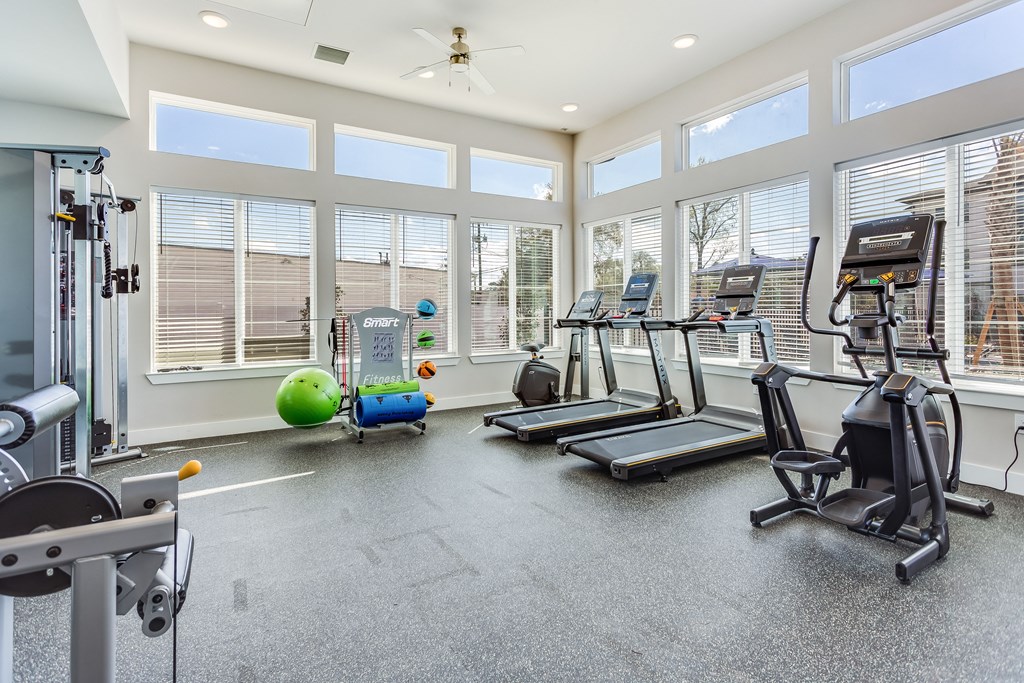 the gym at the enclave at woodbridge apartments in sugar land, tx