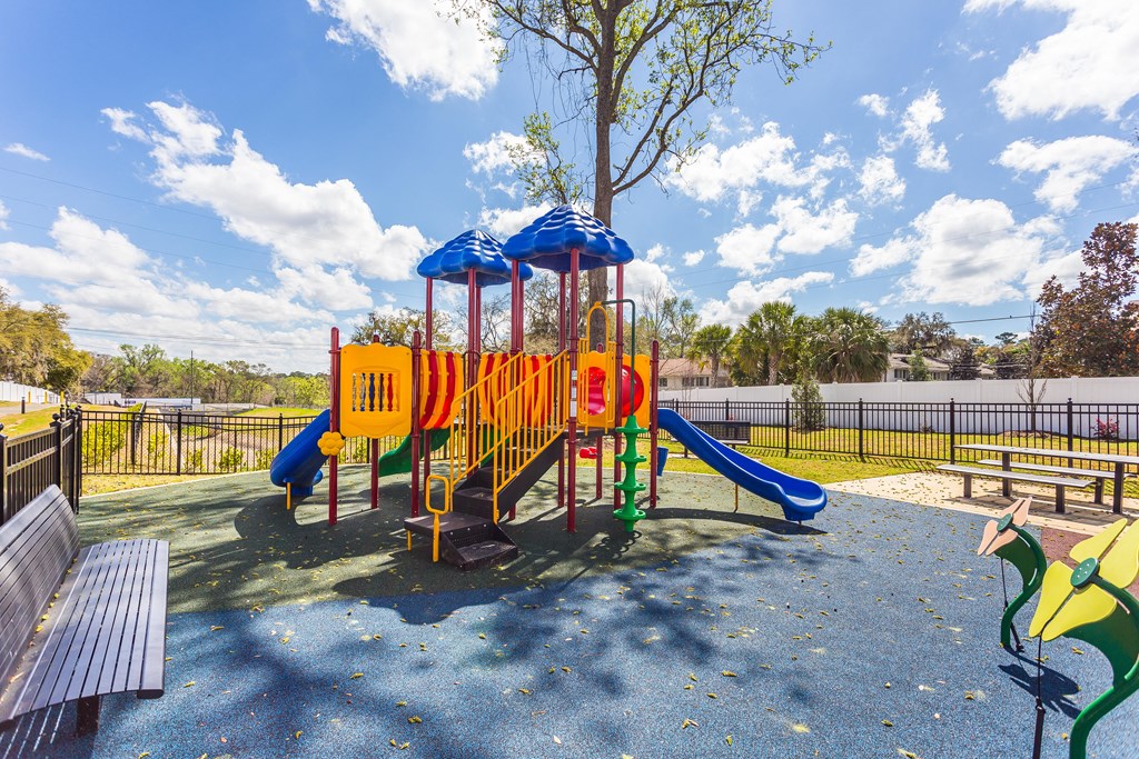 a playground at the enclave at woodbridge apartments in sugar land, tx