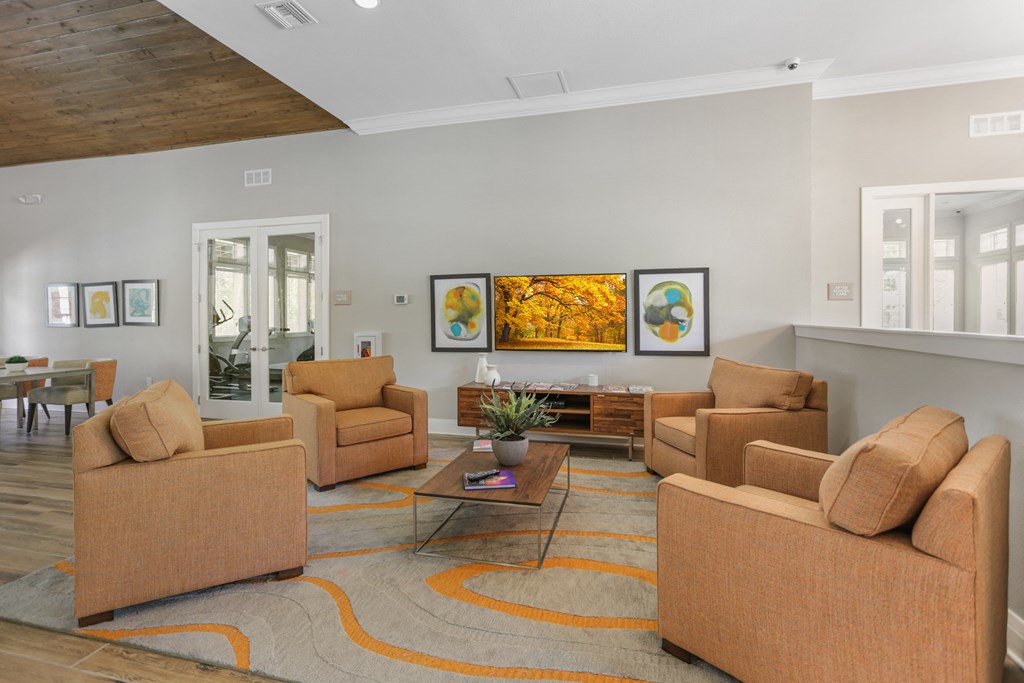 a living room with couches and chairs