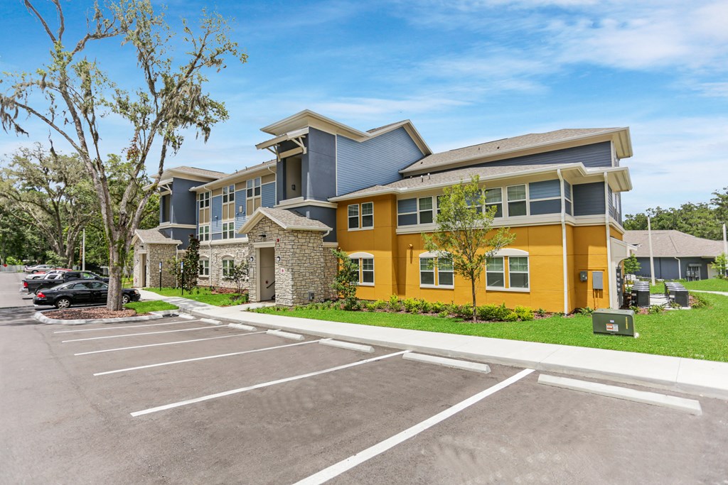 a large building with a parking lot in front of it