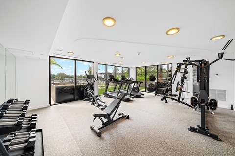 A spacious home gym with a variety of equipment.