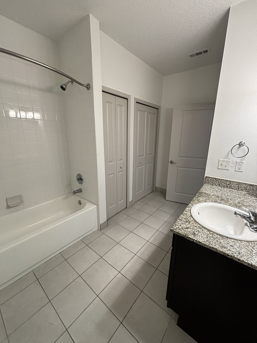 a bathroom with a sink and a bath tub