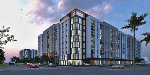 A modern multi-story building with a red and white stripe on the top floor is depicted.