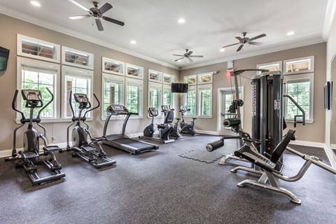 A spacious home gym with a variety of exercise equipment.