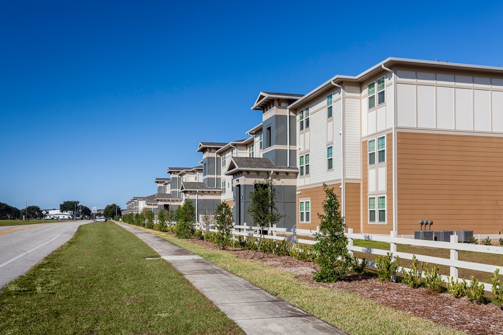 a row of townhomes along a road