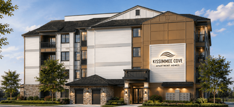 The image shows a modern apartment building named Kissimmee Cove Apartments.