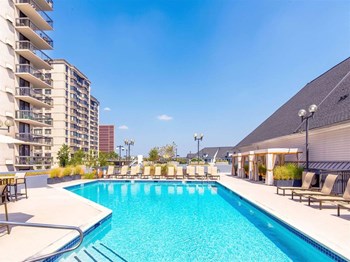 Luxury, resort-style pool with poolside chairs at Prospect Place, New Jersey 07601 - Photo Gallery 6
